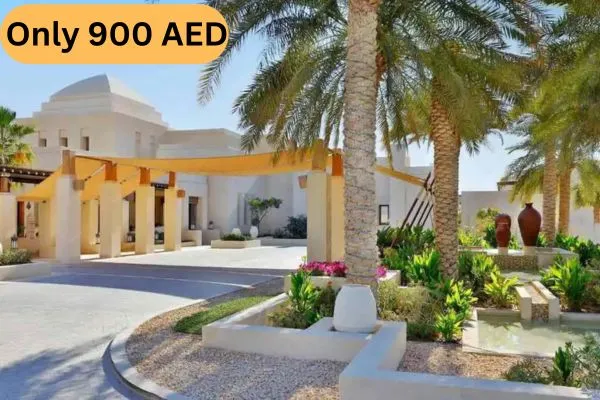 Luxury Arabian Resort Entrance with Palm Trees for VIP Desert Safari Abu Dhabi Package