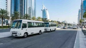 White minibuses for centralized desert safari pickup in Abu Dhabi