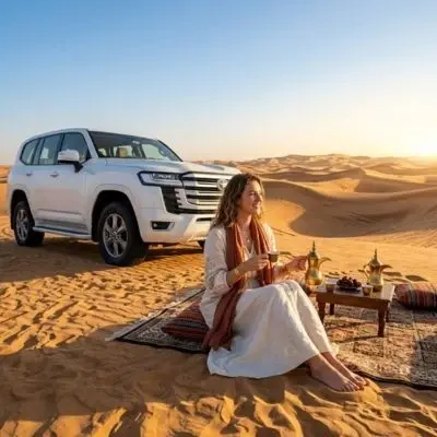 Guest on the dunes during a morning desert safari near Abu Dhabi