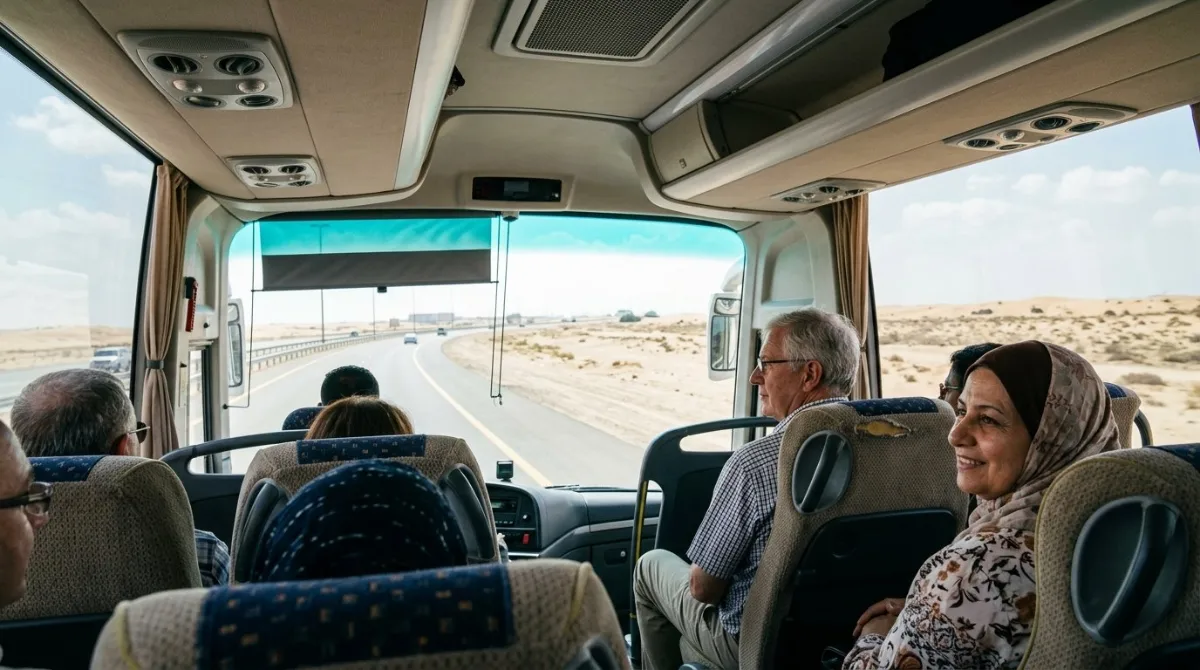 Passengers seated in the air-conditioned coach heading out of Abu Dhabi to the desert camp